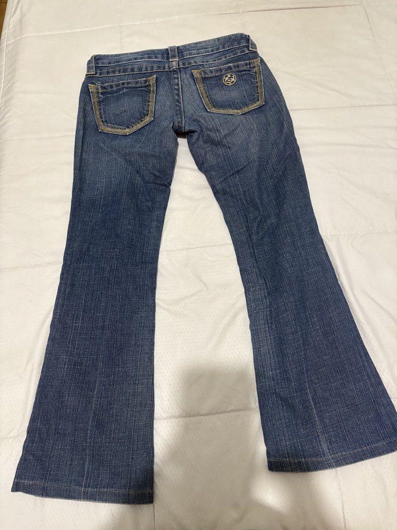 Bebe Blue Denim Jeans Size 26 (Category: Jeans) located in Manila. Submitted by nykji96 (Listing ID 1470567175, Image 2). Description: - Brand: Bebe - Wash: Medium blue - Fit: Low rise with bootcut legs - Details: Contrast stitching on front/back pockets - Special Feature: Signature round bling logo hardware on the back right pocket - Size: Tagged waist 26 - Origin: Made in Mexico - Condition: Excellent pre-loved condition (or brand new, ready to