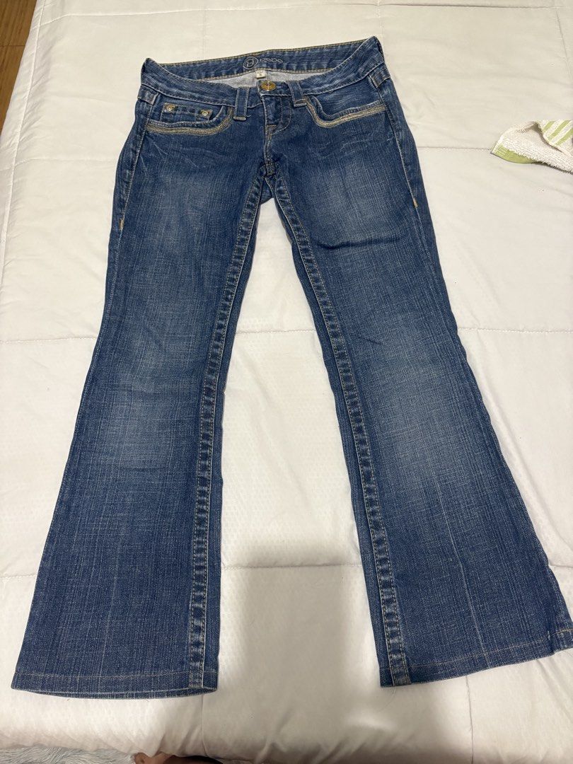 Bebe Blue Denim Jeans Size 26 (Category: Jeans) located in Manila. Submitted by nykji96 (Listing ID 1470567175, Image 1). Description: - Brand: Bebe - Wash: Medium blue - Fit: Low rise with bootcut legs - Details: Contrast stitching on front/back pockets - Special Feature: Signature round bling logo hardware on the back right pocket - Size: Tagged waist 26 - Origin: Made in Mexico - Condition: Excellent pre-loved condition (or brand new, ready to