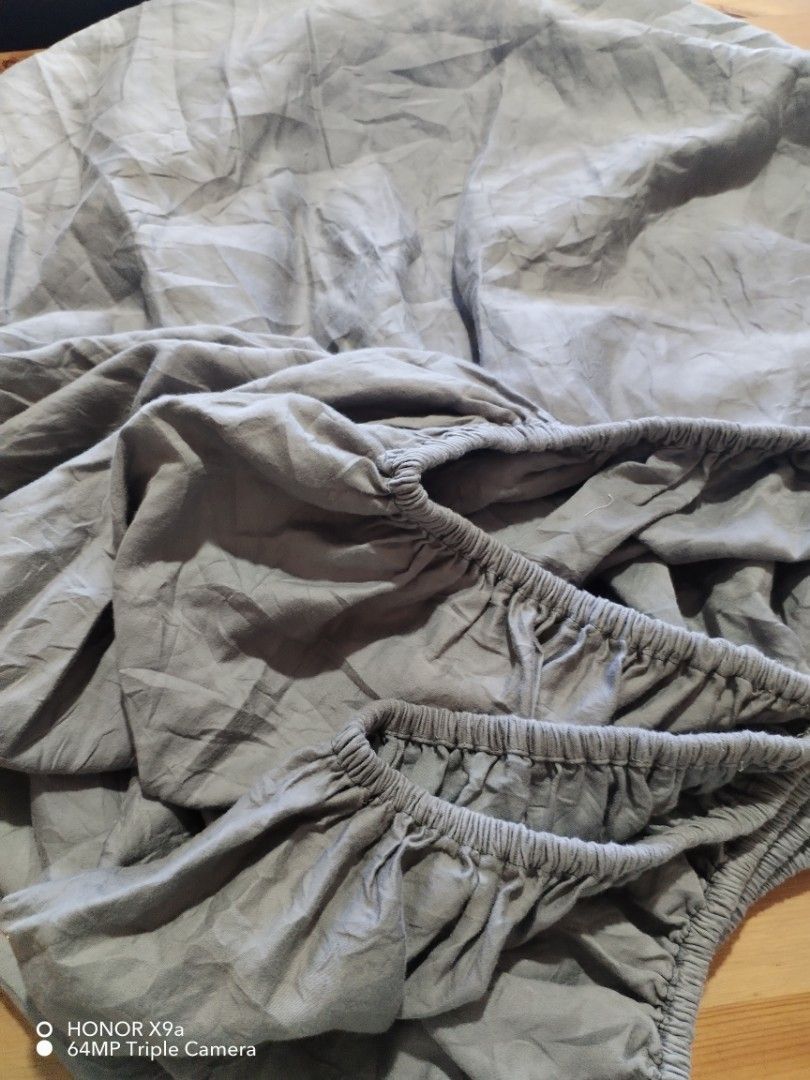 Bedsheets Gray Color (Category: Bedding & Towels) located in Muntinlupa City. Submitted by arciagamaryann68 (Listing ID 1470617306, Image 3). Description: - Color: Gray - Type: Fitted bedsheet with elastic garterized edges - Condition: Well-maintained, clean, and ready to use - Material: Soft and comfortable fabric - Design: Minimalist solid gray that matches any bedroom interior.