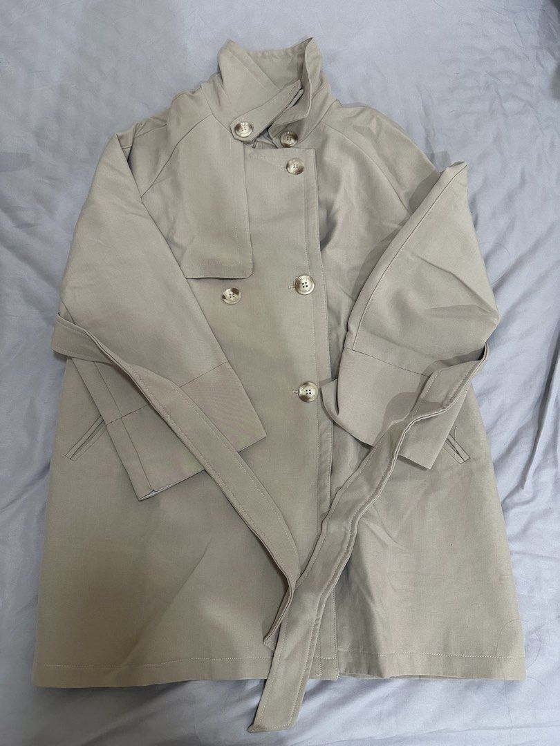 Beige trench coat (Category: Coats, Jackets and Outerwear) located in Pasig City. Submitted by shopmystuff.p (Listing ID 1470740786, Image 1). Description: Good as new Used once for my AU trip Can fit small to medium.