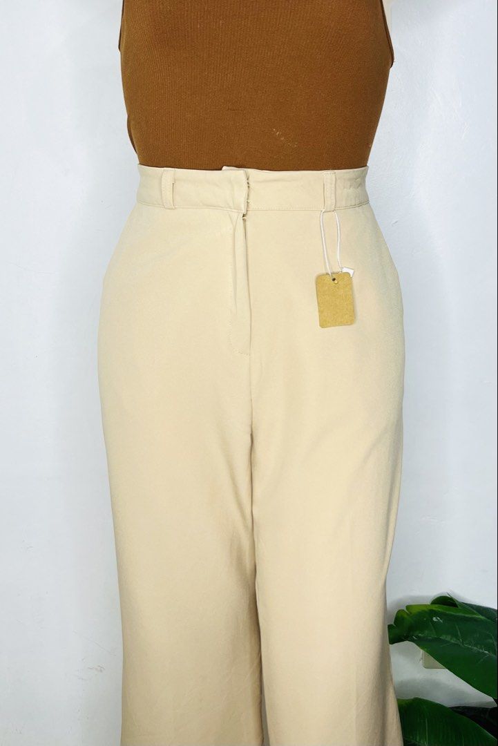 Beige Trouser Pants | Size 29-30 (Category: Jeans) located in Manila. Submitted by bengirlclothing (Listing ID 1470589840, Image 3). Description: - Color: Classic beige - Size: 29-30 inches -Length: 41 inches - Style: High-waisted wide-leg trousers - Fit & Comfort: Super comfy stretchy fabric, clean front waistband with belt loops, and two back welt pockets .