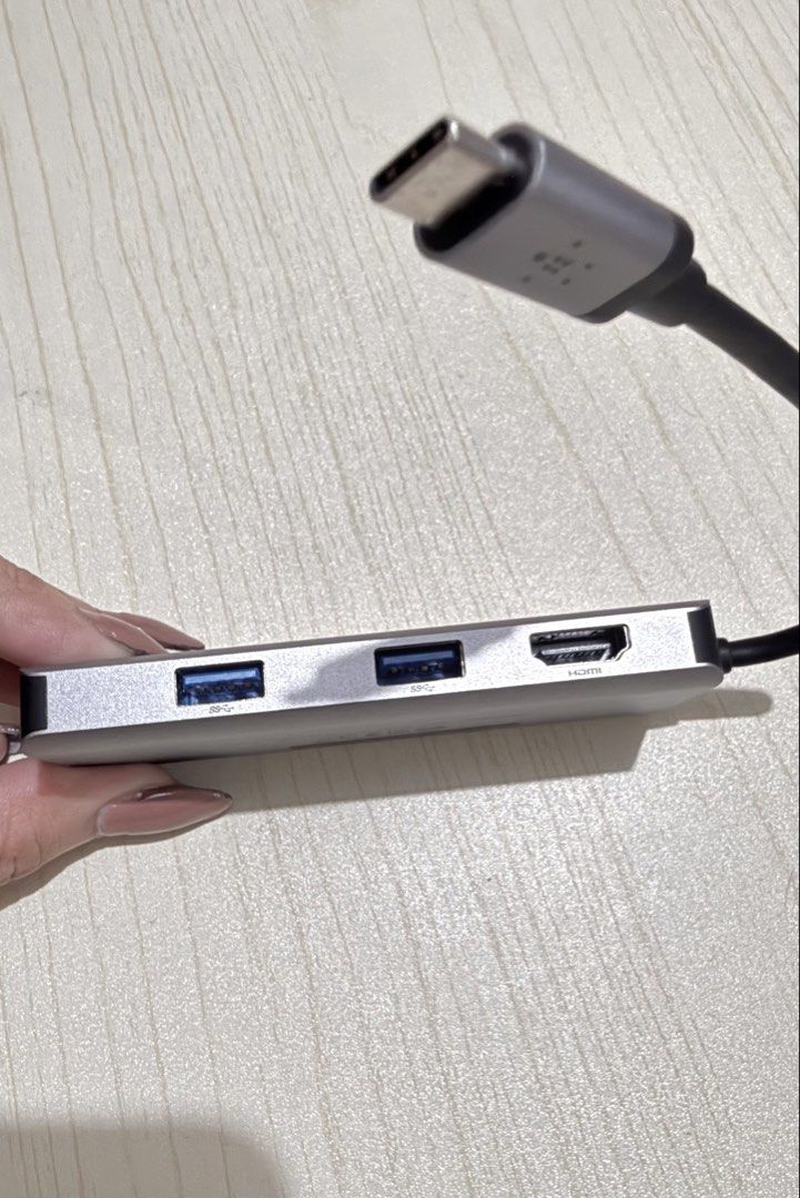 Belkin USB-C 5-in-1 Multiport Dock AVC007 (Category: Cables & Adaptors) located in Manila. Submitted by kweenlee (Listing ID 1470645467, Image 3). Description: - Brand: Belkin 5-in-1 USB-C Hub (Model: AVC007) - Color: Sleek Silver with attached Type-C cable - Ports: 2x USB-A 3.0, 1x HDMI - Card Slots: SD and MicroSD slots on the side - Condition: Excellent, compact design perfect for work, school, or travel - Mode of Payment: GCash, BPI, or COD v