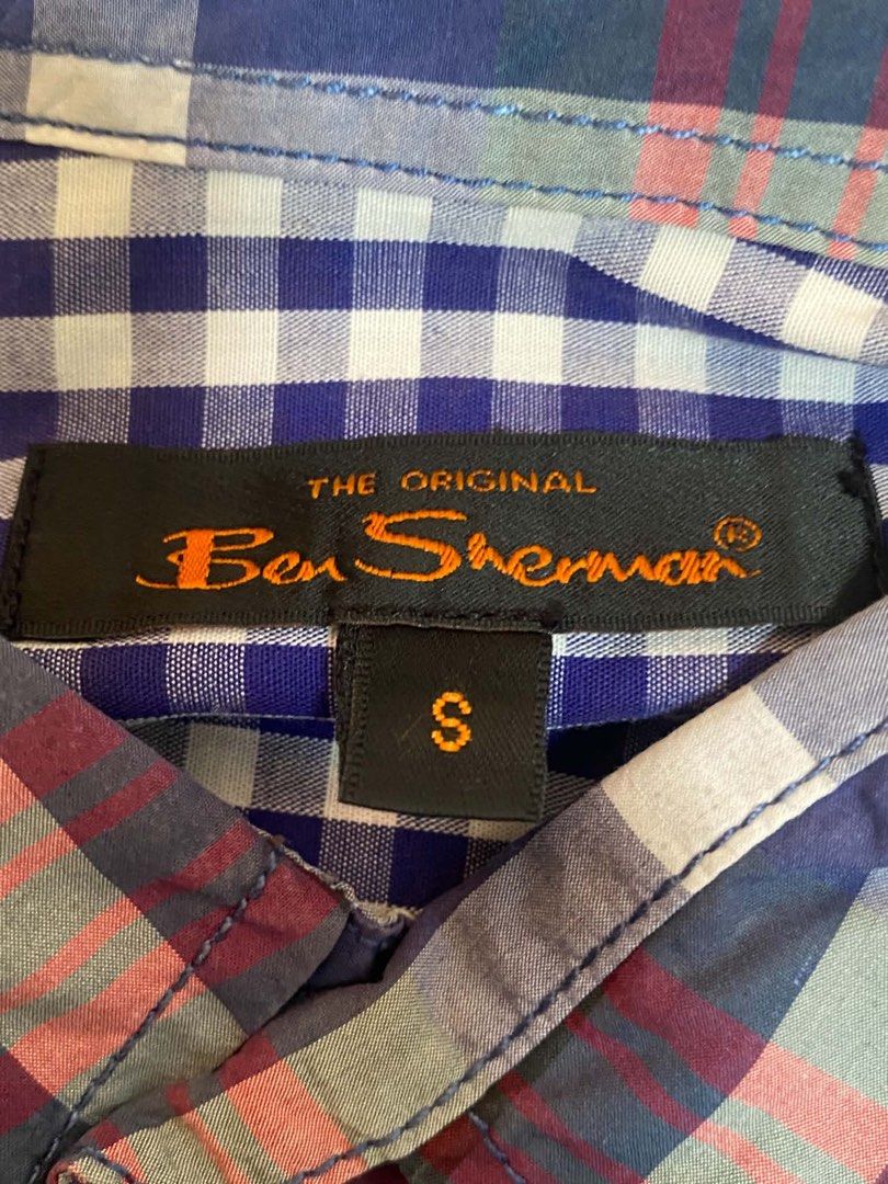 Ben Sherman Plaid Long Sleeve Button-Down Shirt Size S (Category: Formal Shirts) located in Manila. Submitted by judiec29 (Listing ID 1470599726, Image 2). Description: - Brand: Ben Sherman - Style: Long sleeve button-down shirt - Design: Classic plaid pattern in blue, white, and red - Size: Small - Features: Button-down collar, single chest pocket with embroidered logo shield, lightweight cotton fabric - Condition: Clean, well-kept, and ready to