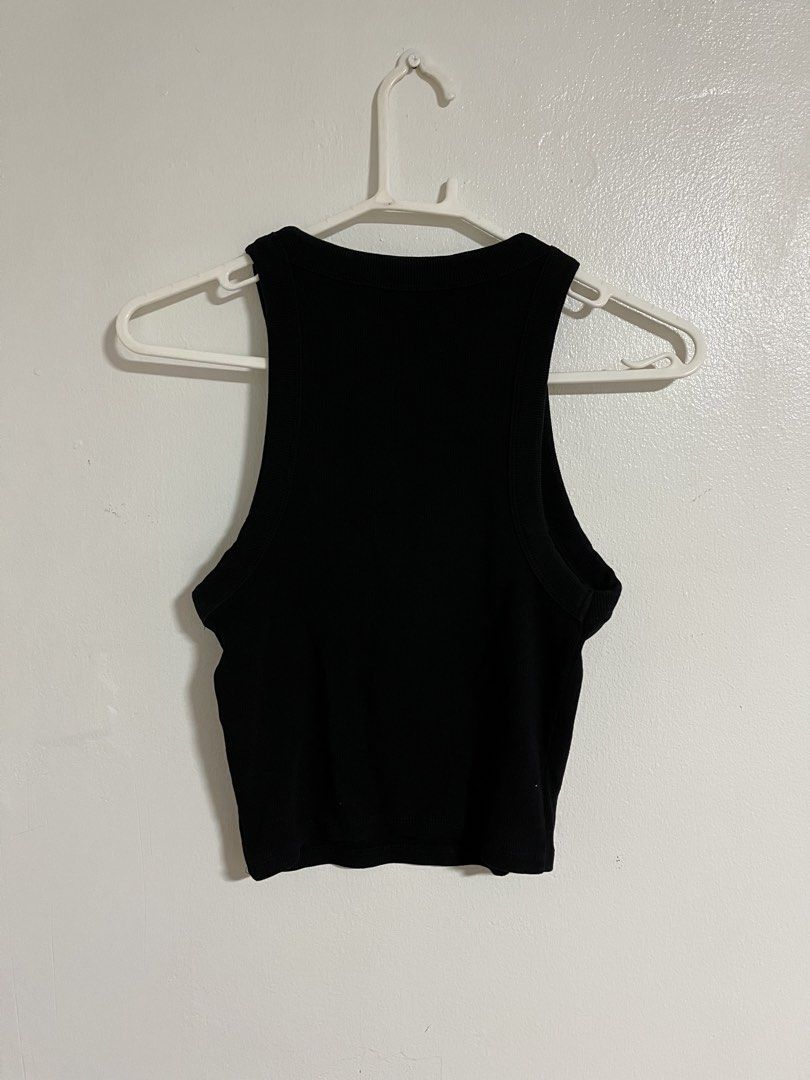 Bershka Black Ribbed Tank Top (Category: Sleeveless) located in Cabuyao City. Submitted by rdtrmt (Listing ID 1470576279, Image 3). Description: - Brand: Bershka - Size: M - Color: Classic Black - Style: Ribbed tank top with racerback cut - Material: Soft, stretchy cotton - Condition: Worn a few times, but still in good condition.