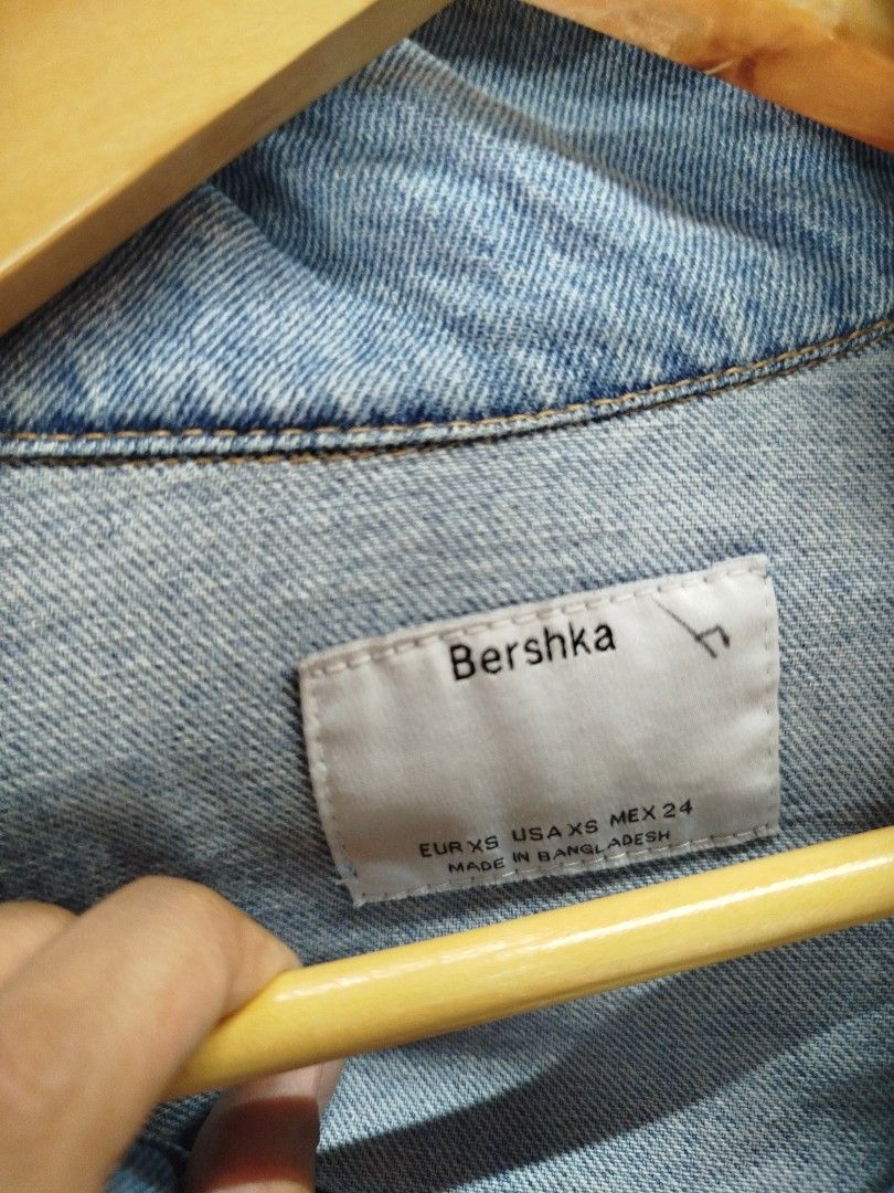 Bershka Denim Jacket Light Blue Size XS (Category: Coats, Jackets and Outerwear) located in Quezon City. Submitted by epoquebyjaz (Listing ID 1470640221, Image 2). Description: - Brand: Bershka - Size: EUR XS / USA XS / MEX 24 - Color/Wash: Light wash denim - Fit: Relaxed fit with structured collar - Features: Classic button-down front, two chest flap pockets, metal hardware - Origin: Made in Bangladesh - Condition/Use: Great layering piece for d