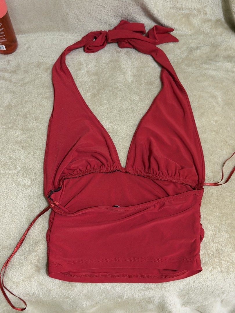 Bershka Red Halter Neck Top (Category: Sleeveless) located in Manila. Submitted by xoxorml (Listing ID 1470698445, Image 2). Description: - Style: Halter top with deep V-neck and slim fit - Material: Stretchy fabric for a comfortable fit - Condition: Clean overall, great going-out piece RFS: Decluttering.