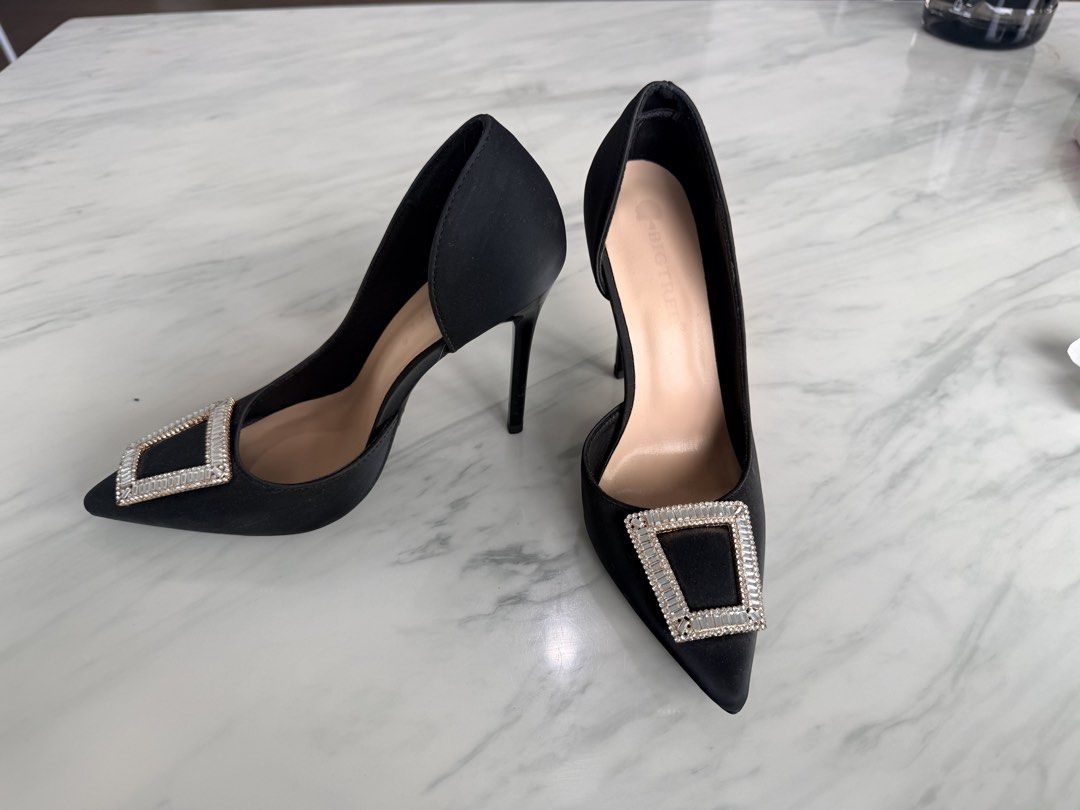 Bigtree Black Rhinestone Pointed Toe Stiletto Heels (Category: Heels) located in Manila. Submitted by janalulu (Listing ID 1470588038, Image 1). Description: - Brand: Bigtree - Style: Pointed toe stiletto heels with slip-on design - Details: Elegant square rhinestone buckle on the toe - Cutout: Trendy d'Orsay cutout sides - Heel: Sleek and thin stiletto - Color: Classic black - Perfect for: Parties, weddings, dinner dates, and formal occasions.