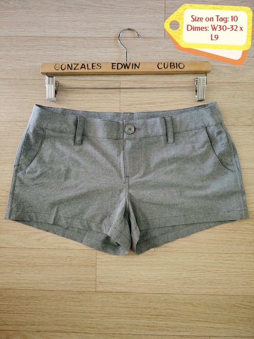 Billabong Grey Shorts Size 10 (Category: Activewear) located in Nasipit. Submitted by edwingonzales498-69377 (Listing ID 1470615578, Image 2). Description: - Brand: Billabong - Color: Heathered grey - Size: 10 (Tagged W30-32 x L9) - Closure & Fit: Button closure with belt loops - Pockets: Convenient front pockets - Details: Subtle embroidered Billabong branding near the pocket - Origin: Designed in Australia, made in China - Care: Cold machine wa