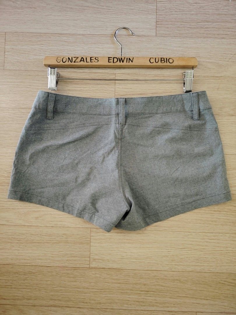 Billabong Grey Shorts Size 10 (Category: Activewear) located in Nasipit. Submitted by edwingonzales498-69377 (Listing ID 1470615578, Image 3). Description: - Brand: Billabong - Color: Heathered grey - Size: 10 (Tagged W30-32 x L9) - Closure & Fit: Button closure with belt loops - Pockets: Convenient front pockets - Details: Subtle embroidered Billabong branding near the pocket - Origin: Designed in Australia, made in China - Care: Cold machine wa
