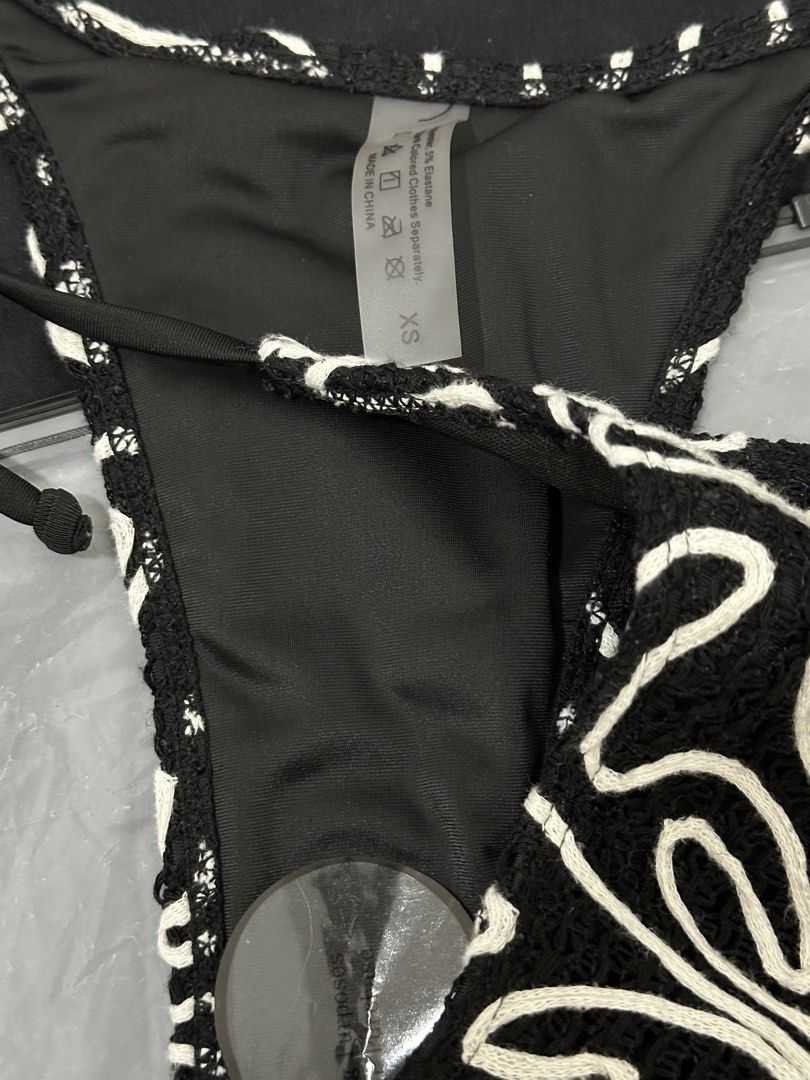 Black and White Bikini - XS (Category: Bikinis & Swimsuits) located in Las Pinas. Submitted by __aqdclttrs (Listing ID 1470615286, Image 2). Description: - Color/Design: Black with white abstract swirl embroidery - Top: Triangle halter with adjustable tie strings - Size: Extra Small (XS). Perfect for xs-small frames - Condition: Brand new with its original packaging, hygiene sticker still in place. Bought this for ₱400+ - rfs: decluttering.