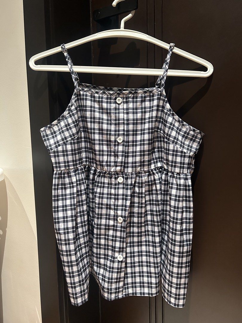 Black and White Plaid Cami Top with Buttons (Category: Sleeveless) located in Davao. Submitted by lachisoo_ (Listing ID 1470710017, Image 1). Description: - Style: Black and white plaid spaghetti strap top - Neckline: Square neckline - Details: Functional white front buttons and flattering gathered waistline - Fabric: Lightweight and comfortable - Fit: True to size - Versatility: Perfect for casual days, layering, or pairing with your favorite je