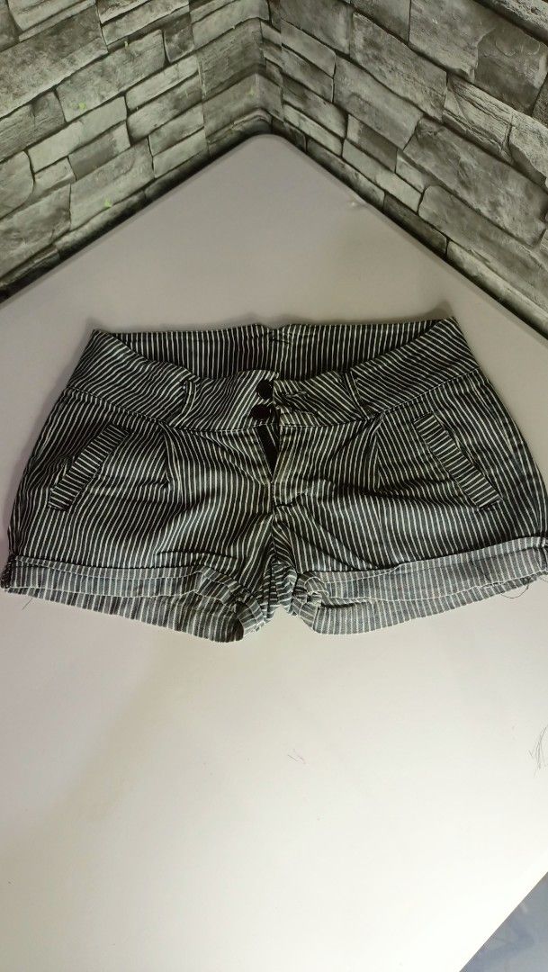 Black and White Striped Rolled Cuff Shorts (Category: Shorts) located in Antipolo. Submitted by reahespiritu (Listing ID 1470619458, Image 1). Description: - Color/Pattern: Black and white vertical pinstripes - Fit: Mid-rise with double button closure and zippered fly - Pockets: Front slant pockets and faux back welt pockets - Details: Stylish folded cuff hems at the bottom - Condition: Excellent, ready to wear.