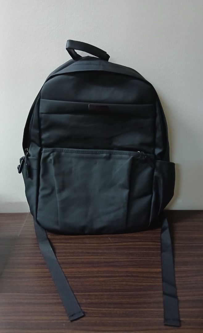 Black Backpack Simple Casual Bag with Mini Pouch Bag (Category: Backpacks) located in Manila. Submitted by townlites (Listing ID 1470566480, Image 2). Description: Lalamove delivery with shipping fee Color: Black Size: 43 x 13 x 28 cm Closure type: zipper With mini pouch bag Fashion bag Backpack style Brand new Quality product.