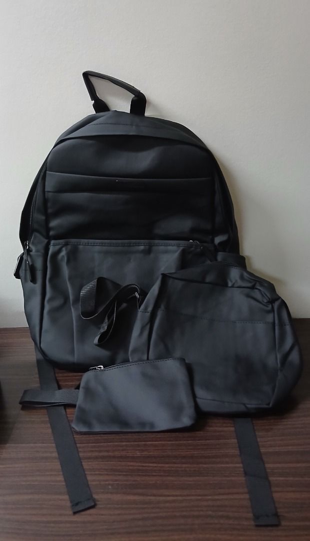 Black Backpack Simple Casual Bag with Mini Pouch Bag (Category: Backpacks) located in Manila. Submitted by townlites (Listing ID 1470566480, Image 1). Description: Lalamove delivery with shipping fee Color: Black Size: 43 x 13 x 28 cm Closure type: zipper With mini pouch bag Fashion bag Backpack style Brand new Quality product.
