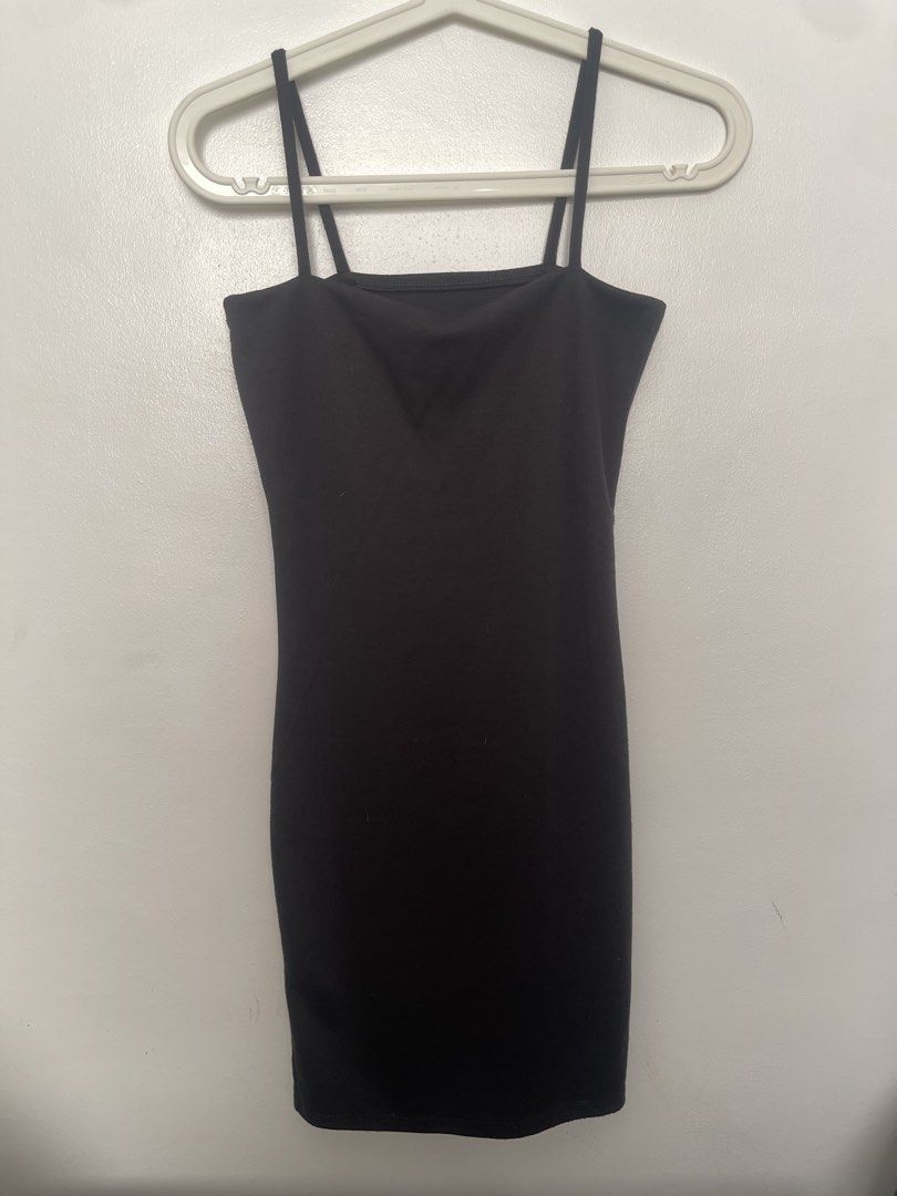 Black bodycon spaghetti strap mini dress (Category: Dresses) located in Manila. Submitted by lovedbymidge (Listing ID 1470646859, Image 1). Description: 🩷 for xs-s girlies 🚚 lalamove or grab express (sf shouldered by the buyer!) - Style: Simple black bodycon dress - Fit: Form-fitting, stretchy fabric, hits above the knee - Details: Spaghetti straps and square neckline - Versatility: Great basic piece for going out or layering.