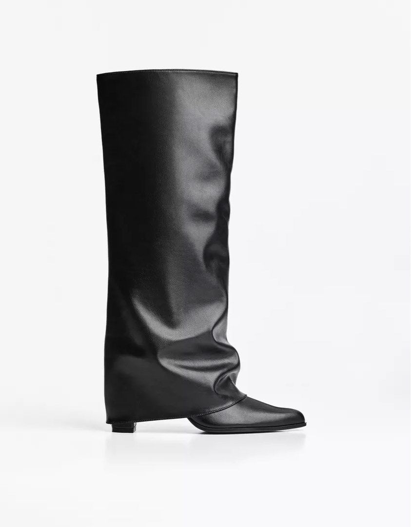 Black Boots from Bershka (WORN ONCE) (Category: Boots) located in Obando. Submitted by playdressup.ph (Listing ID 1470659389, Image 2). Description: - Trendy Y2K aesthetic black slouchy boots - Pointed toe design with mid-calf height - Features a trendy attached folded white knit leg warmer top - Made of durable faux leather - Worn only once, soles are super clean - Fits true to size WORN ONCE ONLY AT SHANGHAI DISNEYLAND 🤍 bought it for ₱5k++ .