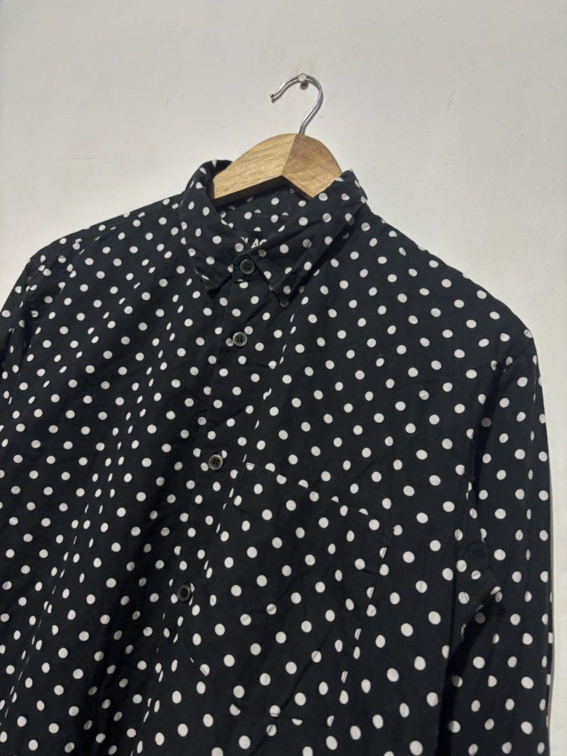 BLACK Comme des Garcons Polka Dot Button-Up Shirt Size L (Category: Shirts) located in Subic. Submitted by thriftpoison (Listing ID 1470655227, Image 2). Description: - Brand/Era: AD2008 Japanese designer piece - Design: Black with all-over white polka dots, classic collar, and single chest pocket - Material: 100% premium cotton, Made in Japan - Size: Tagged L - Length 28 Width 20 - Condition: Clean overall shape, great staple item.