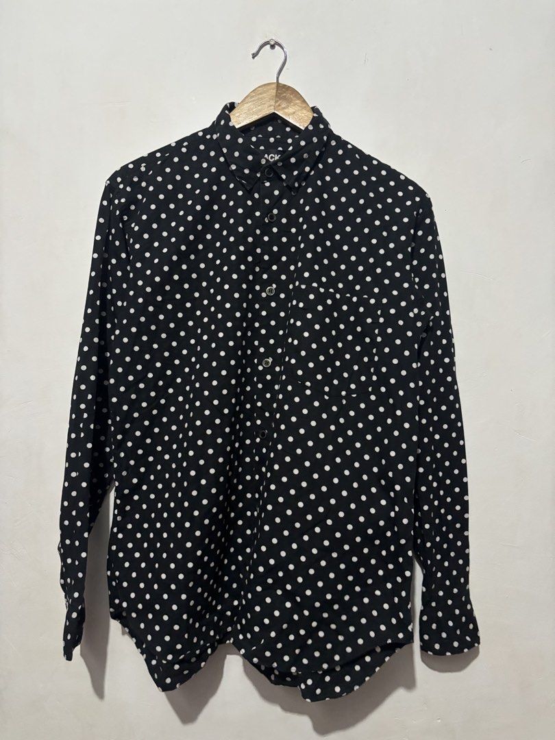 BLACK Comme des Garcons Polka Dot Button-Up Shirt Size L (Category: Shirts) located in Subic. Submitted by thriftpoison (Listing ID 1470655227, Image 1). Description: - Brand/Era: AD2008 Japanese designer piece - Design: Black with all-over white polka dots, classic collar, and single chest pocket - Material: 100% premium cotton, Made in Japan - Size: Tagged L - Length 28 Width 20 - Condition: Clean overall shape, great staple item.