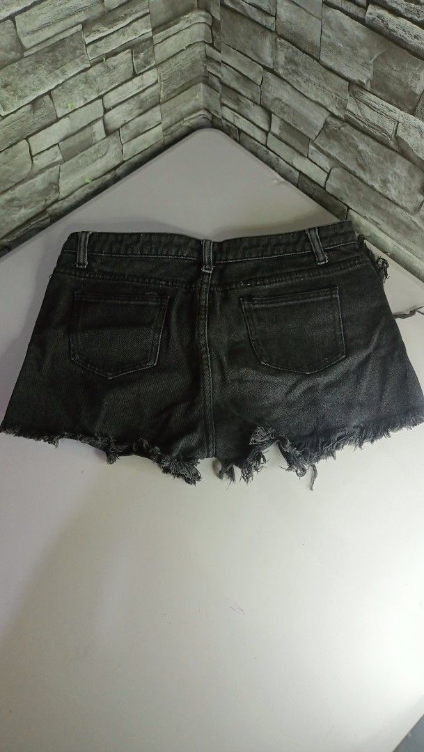Black Denim Cut-Off Shorts (Category: Shorts) located in Antipolo. Submitted by reahespiritu (Listing ID 1470619183, Image 2). Description: - Color/Wash: Washed black - Style: Casual mid-rise denim shorts with raw frayed hems - Features: Classic five-pocket design, zipper fly, and button closure - Perfect for: Everyday warm-weather styling - Status: On hand and ready for shipping.