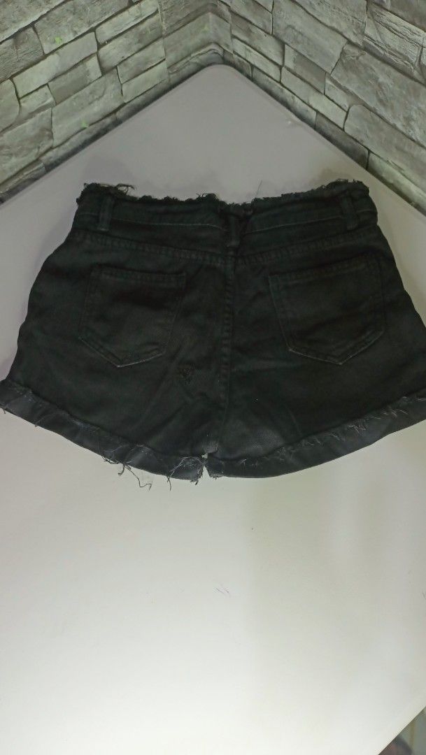 Black Denim Cut-off Shorts with Raw Hems (Category: Shorts) located in Antipolo. Submitted by reahespiritu (Listing ID 1470619775, Image 2). Description: - Color: Classic washed black - Design: Distressed raw edges at waist and hem - Closure: Zip fly with button closure - Pockets: Standard front and back pockets - Details: Includes belt loops - Condition/Use: Great wardrobe staple for casual days.