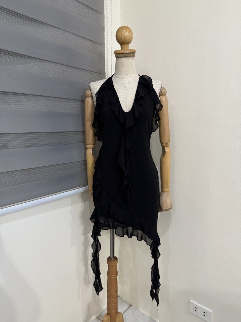 Black Halter Ruffle Mini Dress (Category: Dresses) located in Antipolo. Submitted by jackiestash2 (Listing ID 1470644626, Image 1). Description: - Color: Black - Style: Bodycon, sleeveless mini dress - Neckline: Halter neck tie with deep V-neck and ruffle trim - Details: Ruffle trim down the center front, sheer mesh hem, and hanging side ribbons - Fit: Form-fitting and short length - Perfect for: Night outs, parties, and clubbing Antipolo Gcash/B