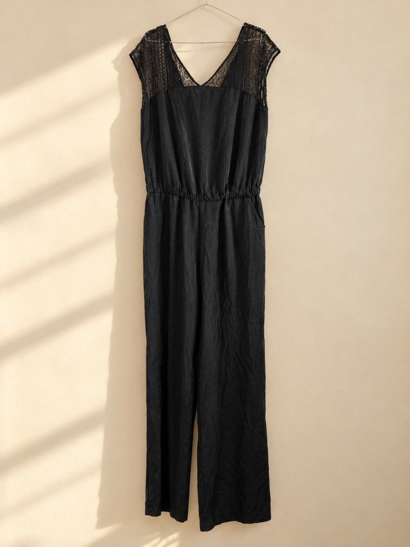 Mossimo Black Lace Trim Sleeveless Jumpsuit (Category: Jumpsuits) located in Cavite. Submitted by myprelovedpicks123 (Listing ID 1470668763, Image 3). Description: - Color: Black - Style: Sleeveless jumpsuit with wide straight legs - Details: Gorgeous lace panels on shoulders and back, V-neckline front and back - Fit: Easy slip-on style with a comfortable elastic waist - Fabric: Lightweight and breathable, perfect for warm weather or layering - C