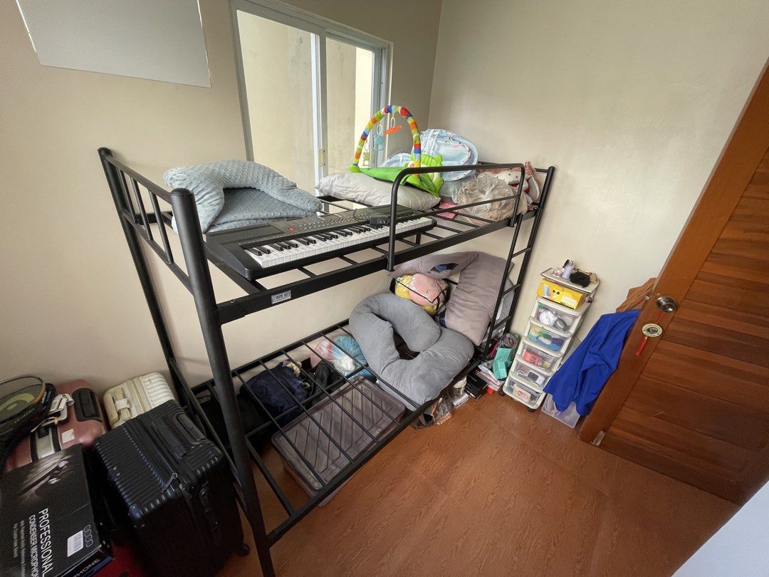 Black Metal Bunk Bed Frame (Category: Bed Frames & Mattresses) located in Caloocan City. Submitted by anjpot (Listing ID 1470611058, Image 3). Description: - Type: Sturdy Black Metal Bunk Bed - Design: Clean industrial style, great for dorms, kids' rooms, or guest rooms - Features: Built-in ladder on the right side - Sizing: Standard twin / single size (fits most mattresses) - Durability: Solid metal construction built to last - Note: Disassembly