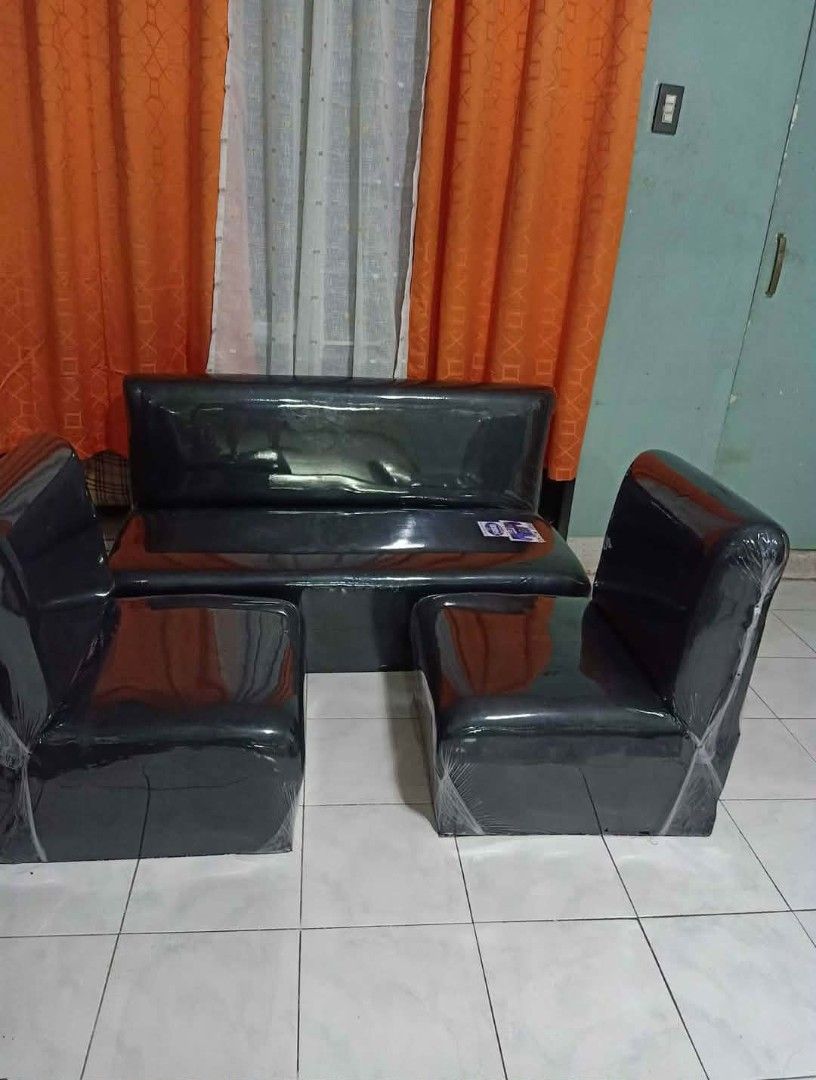 Black modular sectional sofa set with leather-like finish (Category: Sofas) located in Manila. Submitted by shawn0320_fish (Listing ID 1470675263, Image 1). Description: - Matching black sofa set: 1 long bench seat and 2 standalone side chairs - Material: Glossy synthetic leather, completely wrapped in protective plastic - Design: Modern dark finish with a sturdy build - Ideal for clean and stylish living room setups.
