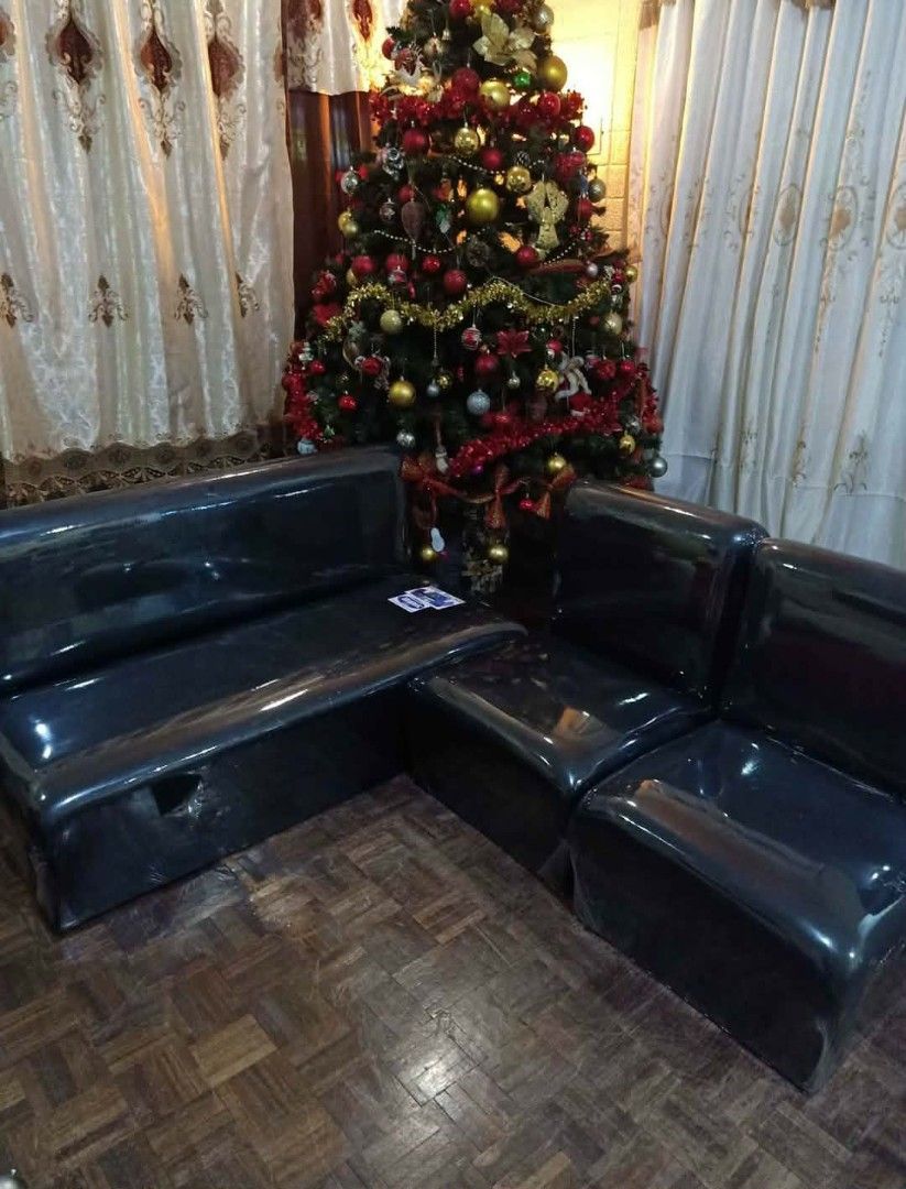 Black modular sectional sofa set with leather-like finish (Category: Sofas) located in Manila. Submitted by shawn0320_fish (Listing ID 1470675263, Image 2). Description: - Matching black sofa set: 1 long bench seat and 2 standalone side chairs - Material: Glossy synthetic leather, completely wrapped in protective plastic - Design: Modern dark finish with a sturdy build - Ideal for clean and stylish living room setups.