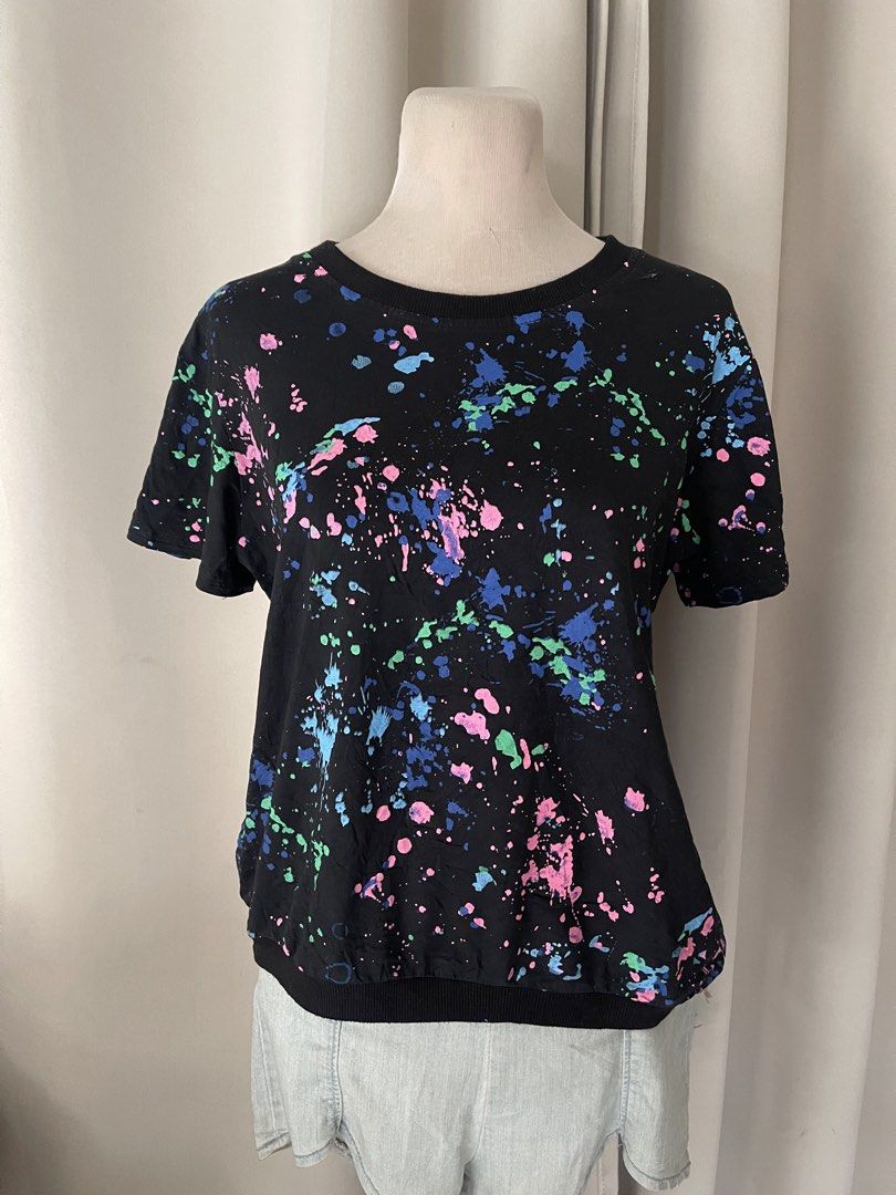 Black Paint Splatter Print (Category: Shirts) located in Cainta. Submitted by zlove111 (Listing ID 1470738437, Image 1). Description: - Color: Black with blue, pink, and green paint splatter print - Fit: Relaxed fit with ribbed round neckline and hem - Special Feature: Functional side pockets - Styling: Easy to match with jeans or shorts - Condition: Brand new / Excellent quality up to large 20" .