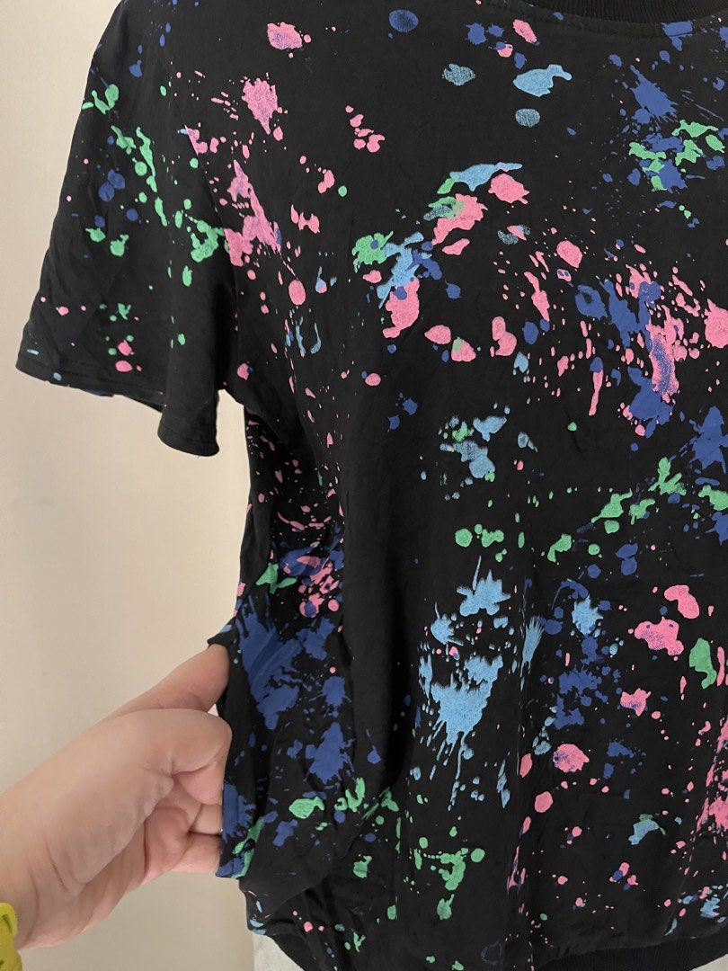 Black Paint Splatter Print (Category: Shirts) located in Cainta. Submitted by zlove111 (Listing ID 1470738437, Image 2). Description: - Color: Black with blue, pink, and green paint splatter print - Fit: Relaxed fit with ribbed round neckline and hem - Special Feature: Functional side pockets - Styling: Easy to match with jeans or shorts - Condition: Brand new / Excellent quality up to large 20" .