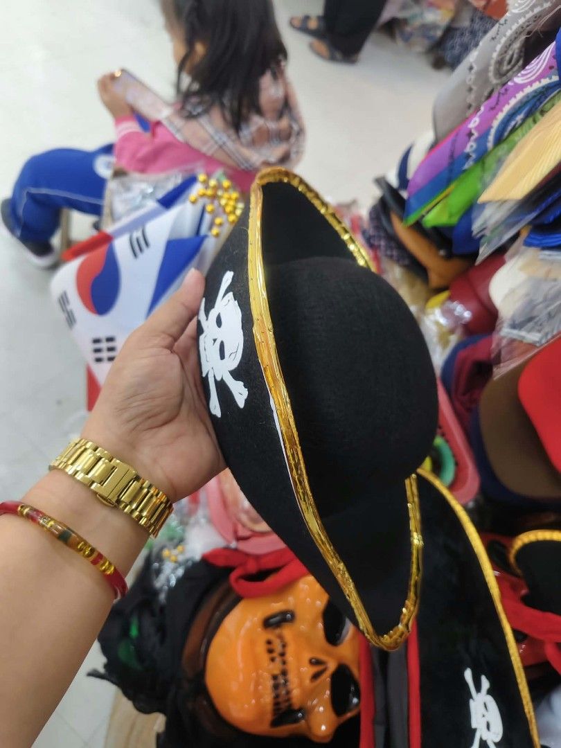 Black Pirate Hat with Skull and Crossbones (Category: Caps & Hats) located in Manila. Submitted by neojamesca55018 (Listing ID 1470616976, Image 3). Description: - Item: Pirate Hat - Design: Classic black with white skull and crossbones graphic and gold trim - Material: Felt-like - Size: Standard adult or older kids - Perfect for: Halloween parties, school plays, and dress-up.