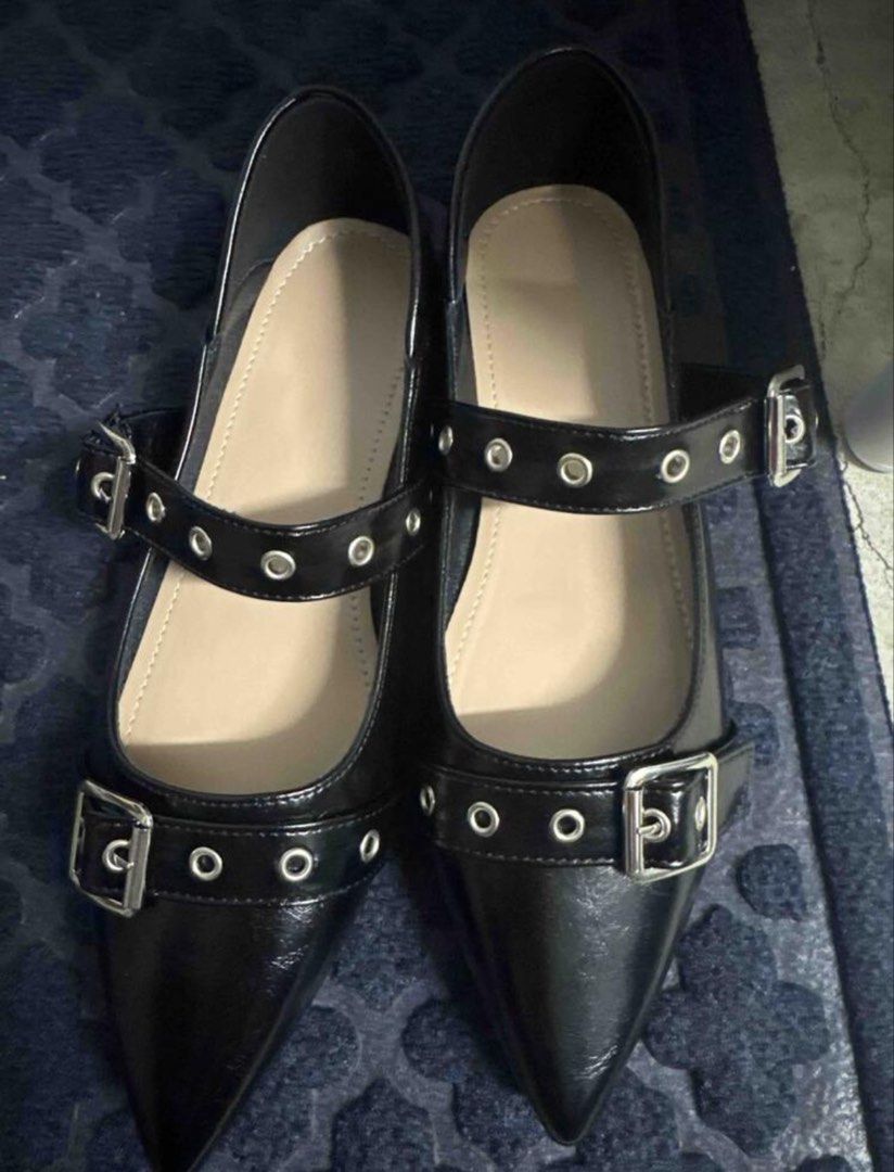 Black Pointed Toe Grommet Buckle Flats (Category: Flats & Sandals) located in Dasmarinas. Submitted by ryedselling (Listing ID 1470621531, Image 1). Description: - Color & Finish: Sleek black patent finish - Design: Pointed toes with double straps, metal eyelets, and silver-tone buckles - Heel Type: Comfortable flat heels for all-day wear - Convenience: Easy slip-on and slip-off style - Inclusions: Original box included.