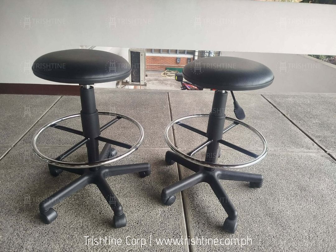 Black Rolling Drafting Stool with Foot Ring (Category: Chairs) located in Caloocan City. Submitted by jim.trishtineofficefurnitures (Listing ID 1470599761, Image 2). Description: - Color & Shape: Black round seat - Mobility: Smooth caster wheels with 5-star sturdy base - Adjustability: Easy-to-use height adjustment lever - Comfort: Built-in chrome foot ring for resting feet - Availability: 2 units in stock (message for details) DISCLAIMER: PRICE 