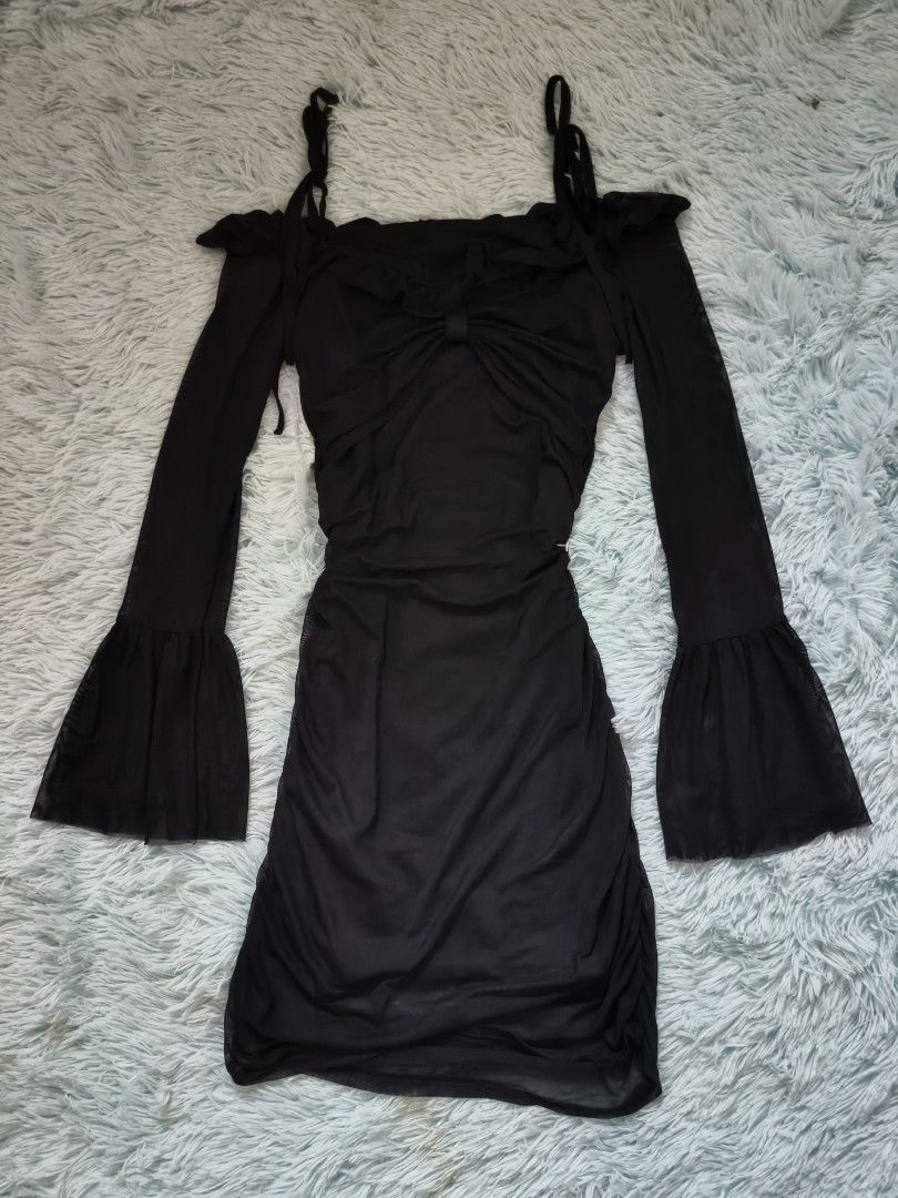 Black ruched mesh long sleeve dress (Category: Dresses) located in Quezon City. Submitted by alluring.avenue (Listing ID 1470671300, Image 1). Description: - Style: Black mesh mini dress with cold shoulders and long bell sleeves - XS-M - Fit: Ruched body creates a super flattering, fitted silhouette - Details: Front bow tie on the bust with ruffle trim along the neckline - Fabric: Stretchy, comfortable material - Occasion: Perfect for parties, da