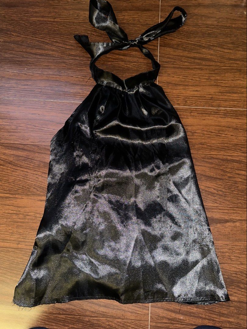 Black Satin Halter Top with Back Bow (Category: Sleeveless) located in Antipolo. Submitted by yhbc08 (Listing ID 1470614739, Image 1). Description: RFS: declutter ✨ ✅Style: Black satin halter top with a glossy, soft finish ✅Detail: Large statement bow at the back ✅Fit: Open-back design with adjustable ribbon closures ✅Perfect for: Date nights, parties, and evening events ✔️ Slight distressed fabric on the front left side, but not so noticeable wh