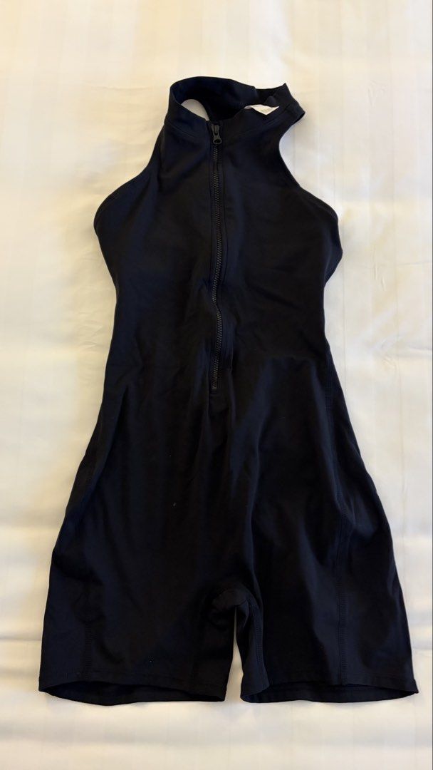 Black sleeveless workout romper bodysuit with front zip (Category: Activewear) located in Manila. Submitted by letmeclean (Listing ID 1470668021, Image 2). Description: - Color: Black - Ideal for: Workouts, yoga, or active wear - Easy front zipper closure for quick wear - Stylish racerback with a trendy back cutout design - Built-in support band for extra security - Sleek, stretchy fabric that hugs your body comfortably - Flattering short biker s