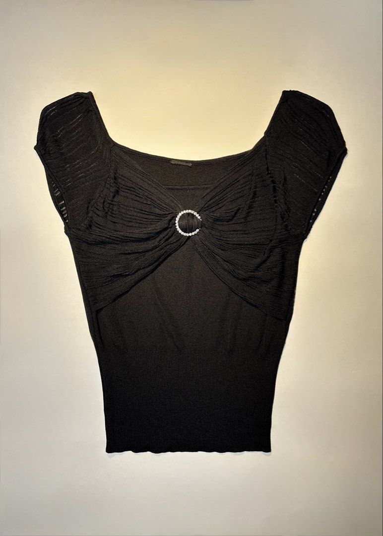 Black square neck knit top with rhinestone ring accent (Category: Sleeveless) located in Bacolod City. Submitted by thlnn_vls (Listing ID 1470702135, Image 1). Description: - Color: Black - Style: Short-sleeve knit top with a wide square neckline - Details: Center bust ruching accented with a sparkling rhinestone ring - Fit: Fitted silhouette with a ribbed hem and stretchy fabric - Occasion: Perfect for evenings and night outs.