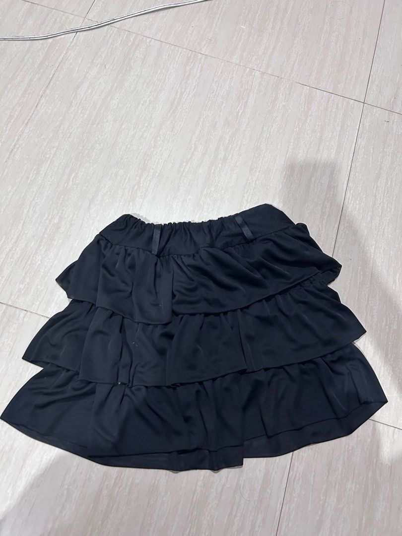 Black Tiered Ruffle Skirt Layered Design (Category: Skirts) located in Manila. Submitted by lovely.453 (Listing ID 1470691221, Image 1). Description: - Color: Black size 25-29 garterize waist - Style: Flowy skater style with layered tiered ruffles - Waistband: Elastic with small side loops - Material: Lightweight and flowy with lots of movement - Versatility: Super easy to pair with any basic top.