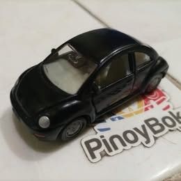 Black Volkswagen Beetle Diecast Toy Car Model (Category: Vehicle & Diecast Models) located in Quezon City. Submitted by susmaryosep1 (Listing ID 1470670921, Image 1). Description: - Model: Black Volkswagen Beetle toy car - Material: Durable diecast metal body with clear plastic windows - Interior: Classic cream seats - Wheels: Silver rims with smooth rolling function - Condition: Solid build quality with minor surface dust from storage - Perfect 