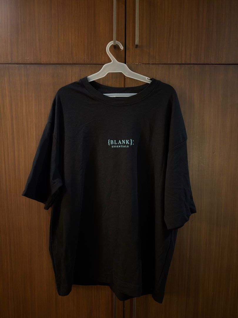 Blank Essentials Black T-Shirt Size XL (Category: Tshirts & Polo Shirts ) located in Manila. Submitted by preloved123. (Listing ID 1470713244, Image 1). Description: - Brand: Blank Essentials - Color: Black - Size: XL - Condition: Brand new with original retail tags attached - Details: Small light blue front chest logo and large Essentials back shoulder print - Fit: Relaxed with dropped shoulders - Origin: Made in Pakistan.