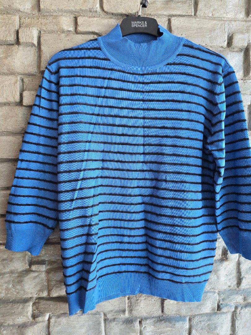Blue and Black Striped Knit Sweater (Category: Longsleeves) located in Quezon City. Submitted by mariescloset2020 (Listing ID 1470574128, Image 1). Description: - Color: Bright blue with vertical black stripes - Material: Soft knit fabric - Fit/Style: Long sleeves, ribbed cuffs, and round neckline - Best for: Cooler days and easy pairing with jeans - Condition: Clean and well-maintained overall.