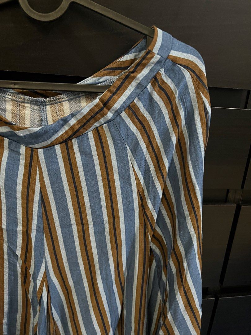 Blue and Brown Striped Aline Skirt (Category: Skirts) located in Quezon City. Submitted by eicadh (Listing ID 1470662608, Image 2). Description: - Trendy blue, brown, and white vertical stripes - Flattering wide-leg cut with a flowy, lightweight drape - Comfortable elastic waistband with stylish gathering - Full-length silhouette with a seamless yoke seam - Easy pull-on style for all-day comfort.