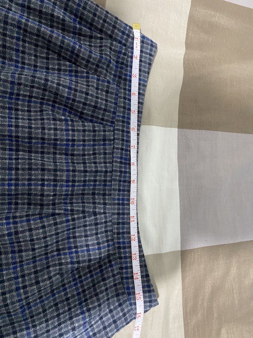 Blue and grey plaid mini skirt (Category: Skirts) located in Binan City. Submitted by jjazrylle (Listing ID 1470730708, Image 3). Description: condi: 10/10 with zipper sa gilid tags 🏷️ - Style: Grey and blue plaid mini skirt with a trendy flared shape - Details: Pleated accents near the waistband and a stylish hem panel - Length: mid - Condition: Clean fabric with solid construction - Perfect for: Casual outings, school fits, or coquette aesthet