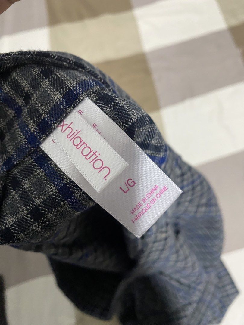 Blue and grey plaid mini skirt (Category: Skirts) located in Binan City. Submitted by jjazrylle (Listing ID 1470730708, Image 2). Description: condi: 10/10 with zipper sa gilid tags 🏷️ - Style: Grey and blue plaid mini skirt with a trendy flared shape - Details: Pleated accents near the waistband and a stylish hem panel - Length: mid - Condition: Clean fabric with solid construction - Perfect for: Casual outings, school fits, or coquette aesthet