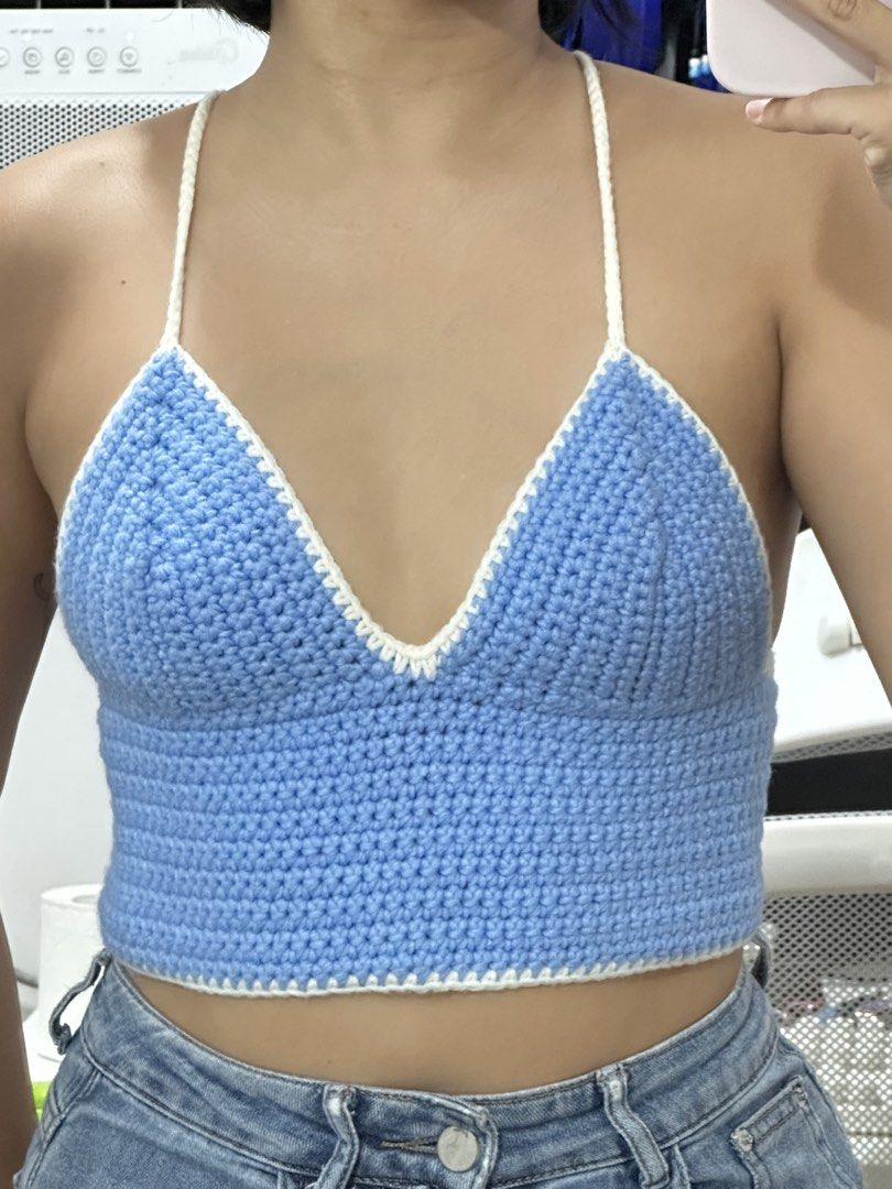 Blue and White Crochet Halter Crop Top (Category: Sleeveless) located in Las Pinas. Submitted by __aqdclttrs (Listing ID 1470624817, Image 1). Description: - Handmade sky blue crochet crop top - Adjustable thin white halter straps and lace-up back tie - Cropped fit, perfect for xs frames .