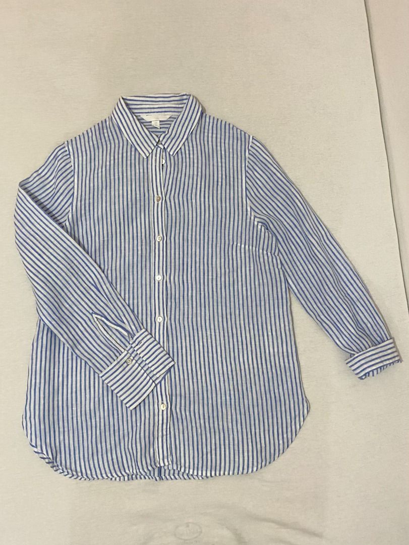 Blue and White Striped Long Sleeve Button-Down Shirt (Category: Longsleeves) located in Bulacan. Submitted by avinadsdeclutter (Listing ID 1470687935, Image 1). Description: - Classic blue and white striped pattern - Lightweight and breathable fabric (Linen) - Long sleeves with structured cuffs - Collared neckline with front button closure - Curved hemline for easy styling (tuck in or wear loose).
