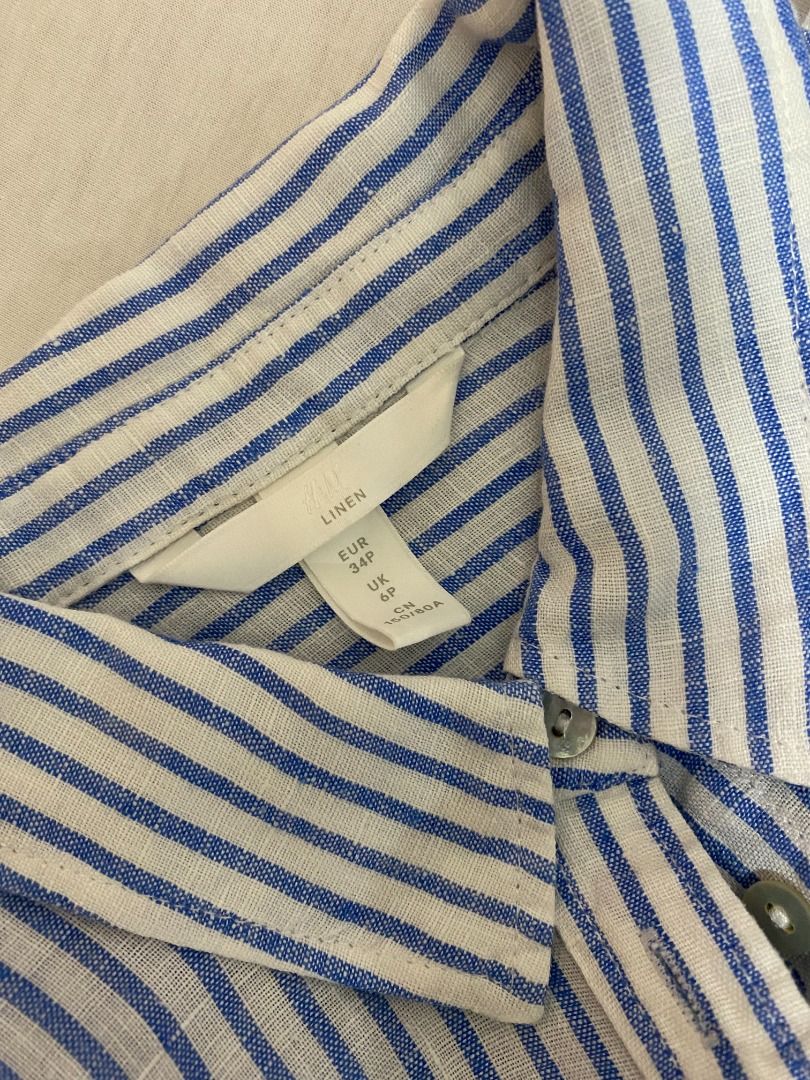 Blue and White Striped Long Sleeve Button-Down Shirt (Category: Longsleeves) located in Bulacan. Submitted by avinadsdeclutter (Listing ID 1470687935, Image 2). Description: - Classic blue and white striped pattern - Lightweight and breathable fabric (Linen) - Long sleeves with structured cuffs - Collared neckline with front button closure - Curved hemline for easy styling (tuck in or wear loose).