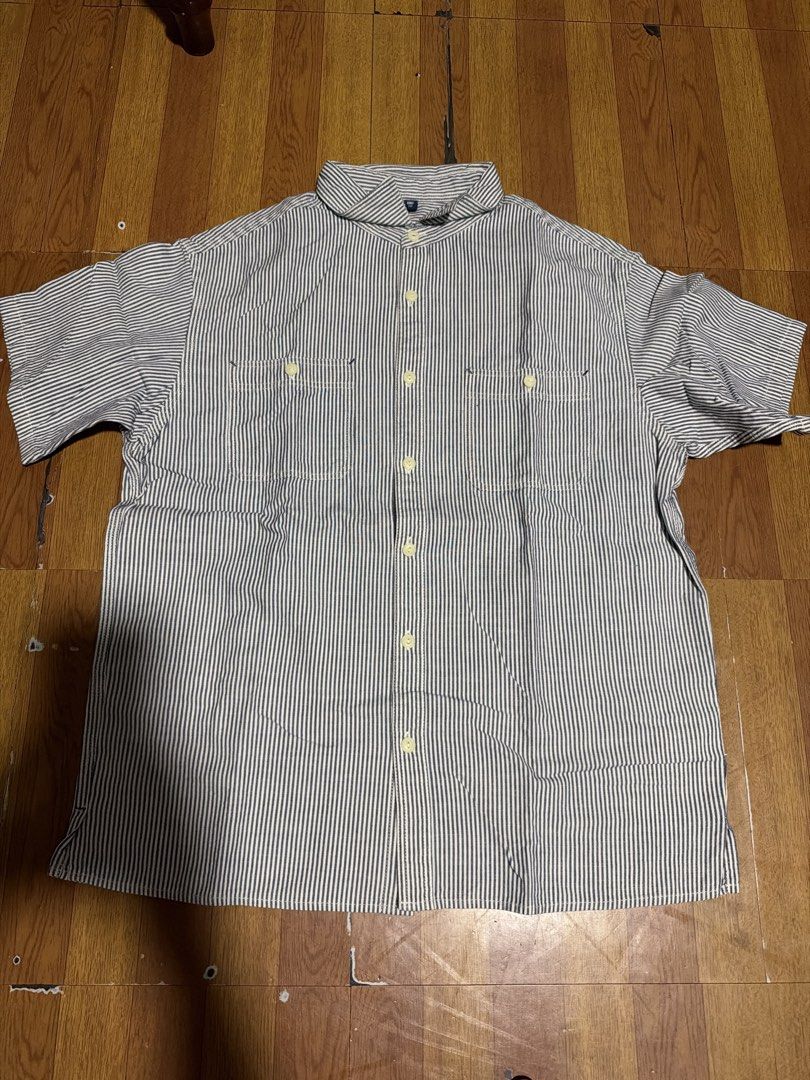 Blue and white striped short sleeve button-up shirt (Category: Shirts) located in Manila. Submitted by annabananna (Listing ID 1470684513, Image 1). Description: - Color/Pattern: Blue and white stripes - Style: Short-sleeve button-up with collar - Features: Two buttoned chest pockets - Fit: Relaxed and lightweight - Condition: Clean and ready to wear - Perfect for: Casual everyday use Size 160 (kids).