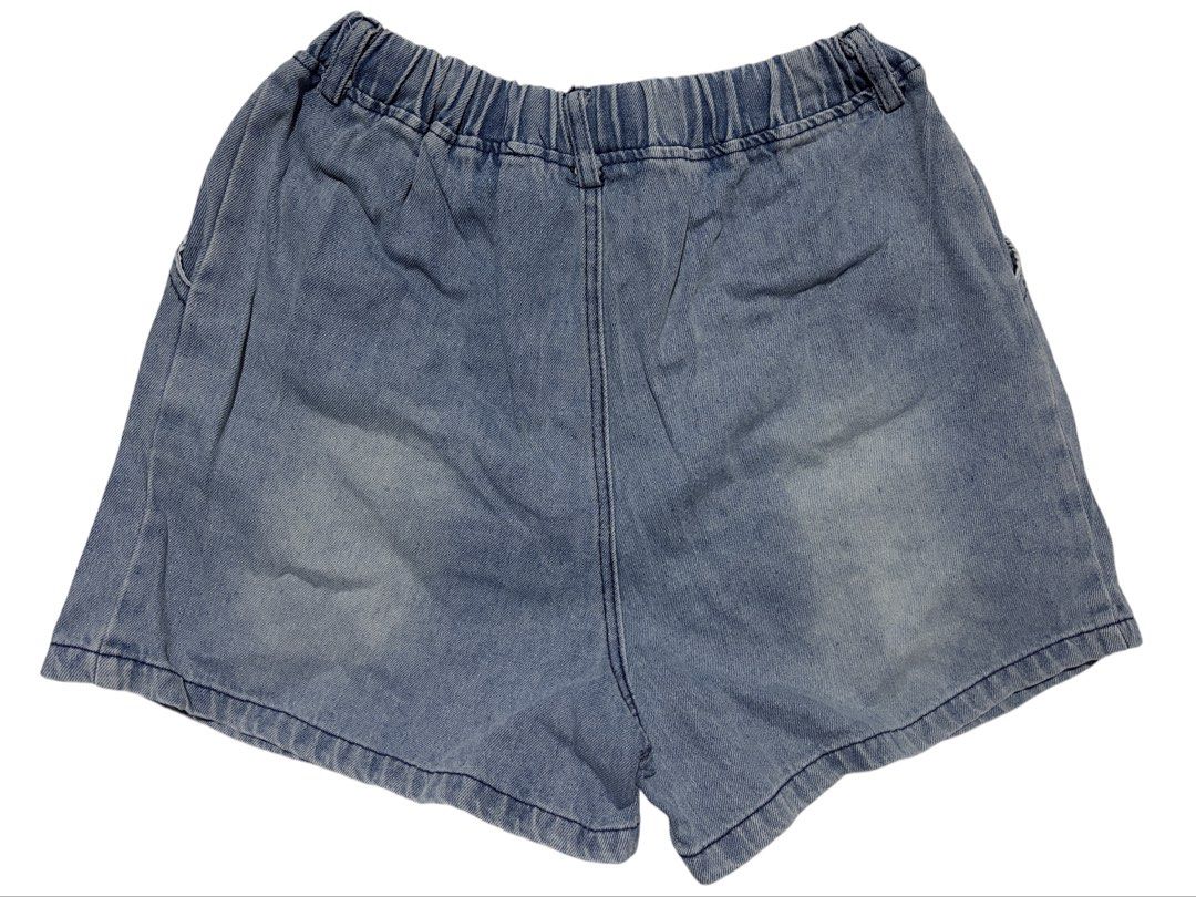 Blue Denim Cargo Shorts with Elastic Waist (Category: Shorts) located in Cavite. Submitted by grandearth.39df3f (Listing ID 1470678018, Image 2). Description: - Style: Relaxed fit blue denim shorts with a pre-washed/faded finish - Waistband: Elastic with gathering and elastic back detail for extra comfort - Pockets: Large cargo pocket on the left leg with metal clasps and D-rings, plus plain back pockets - Condition: Brand new / Excellent quality
